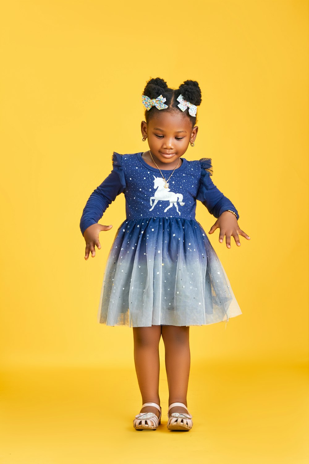 Girl smiling on a yellow background