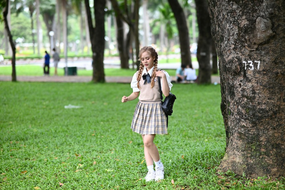 Girl by a tree