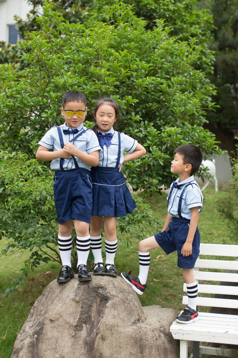 Children posing in school uniform outdoors