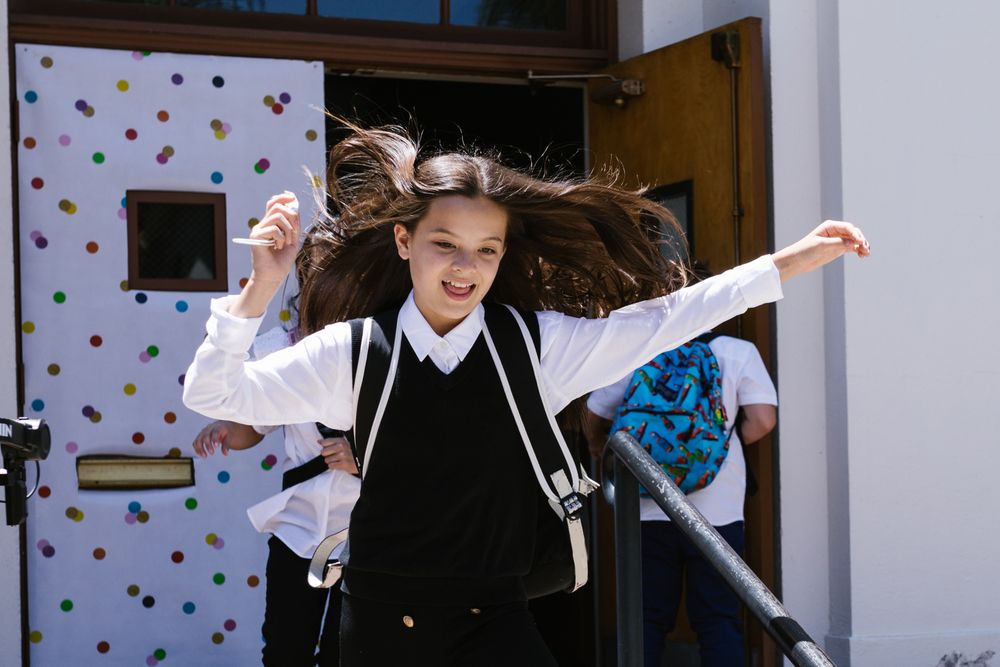 Girl running in uniform
